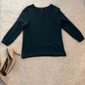 Emerald cashmere sweater w/ embellished neckline.